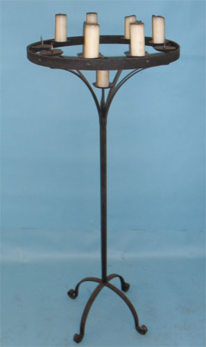 Tall floor standing candelabra with hand scrolled feet