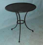 Small round table with perforated top